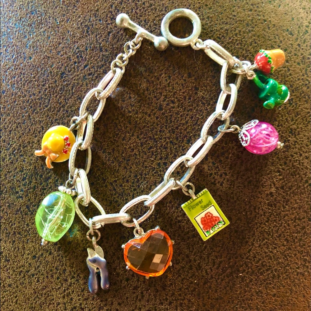 Pretty garden themed charm bracelet silver with  delicate stones and charms